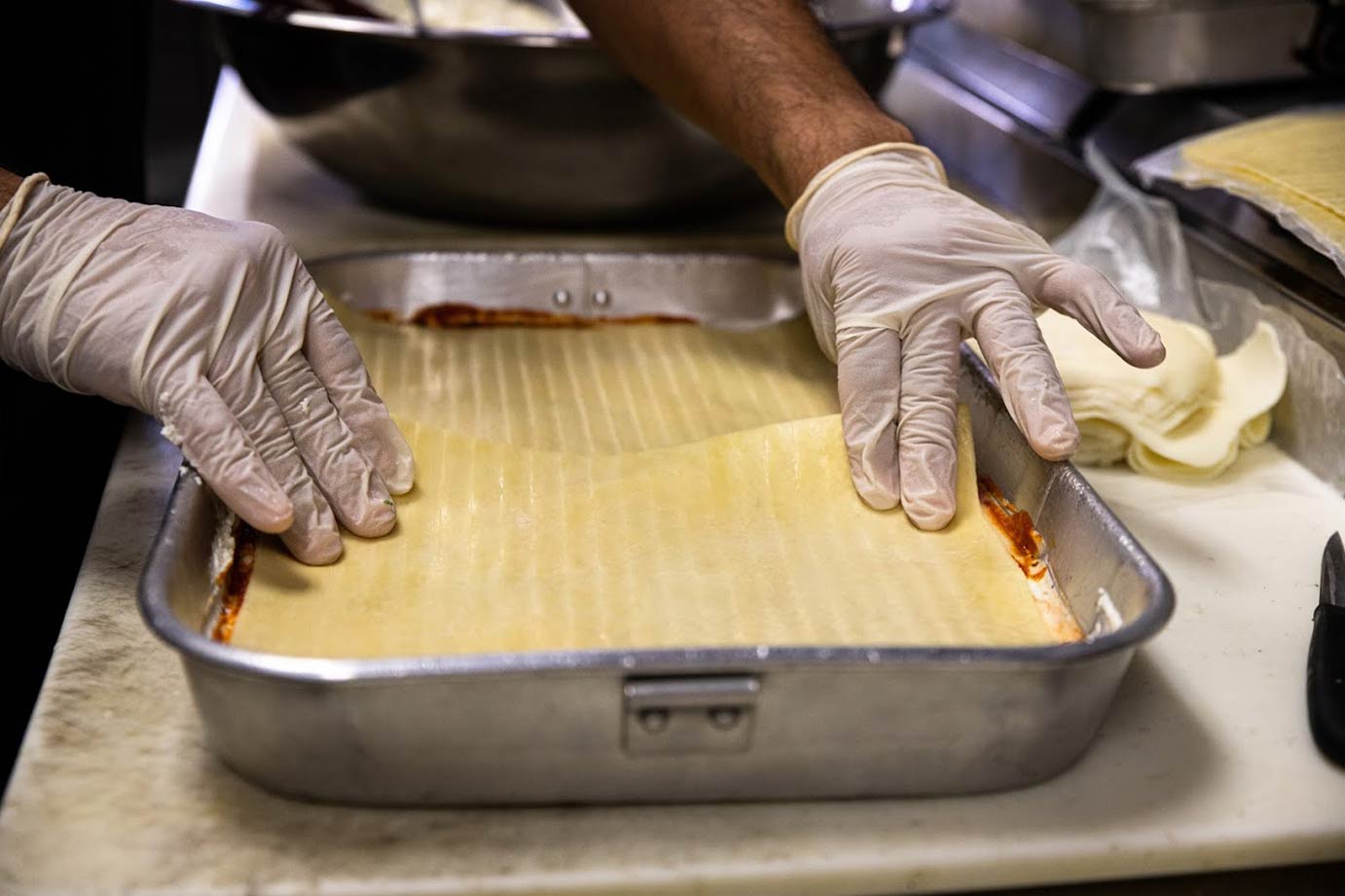 Chef preparing lasagna