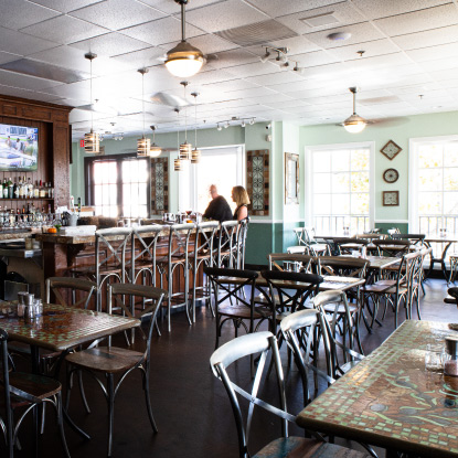 Restaurant interior with bar and tables